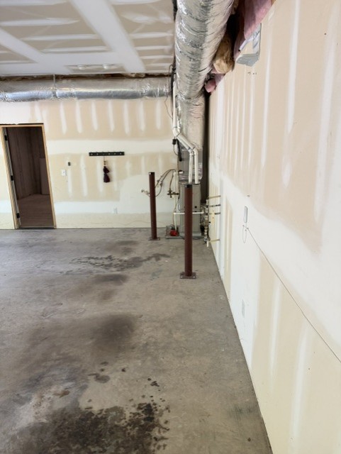 Garage after cleanout with cleared walkway and walls