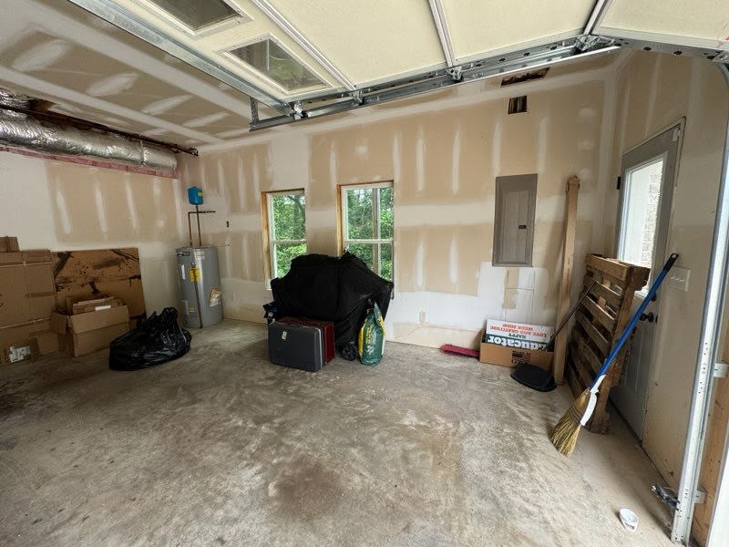 Garage before cleanout with boxes and loose items
