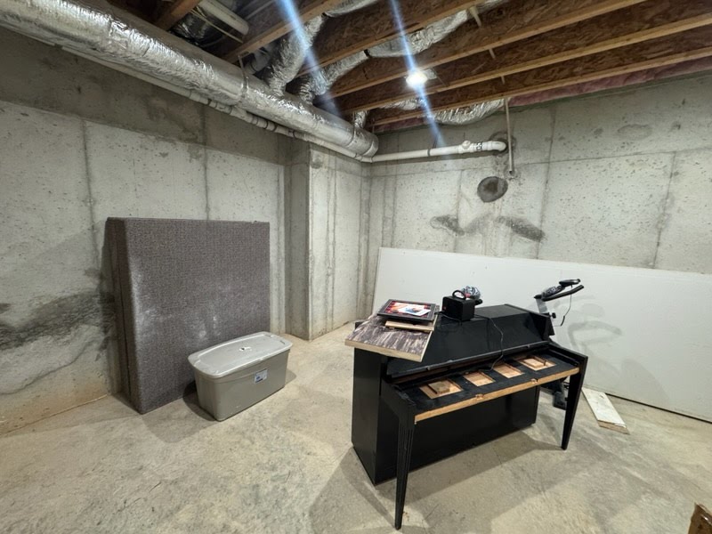 Attic before cleanout with furniture and bags