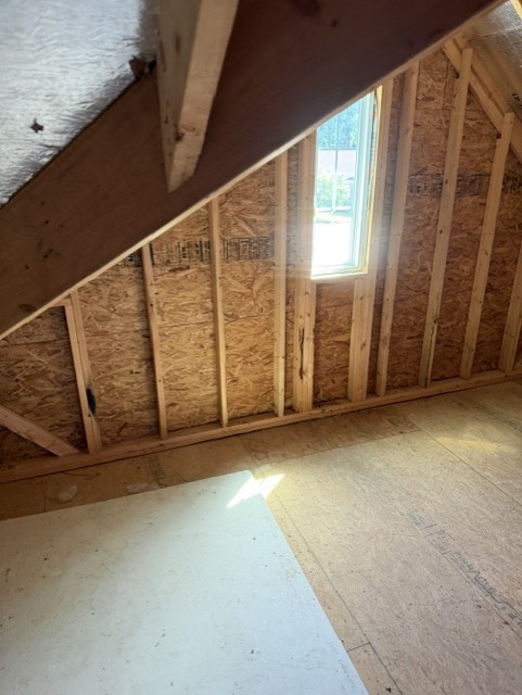 Garage after cleanout with cleared concrete floor